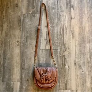 Tan crossbody bag with gold accents